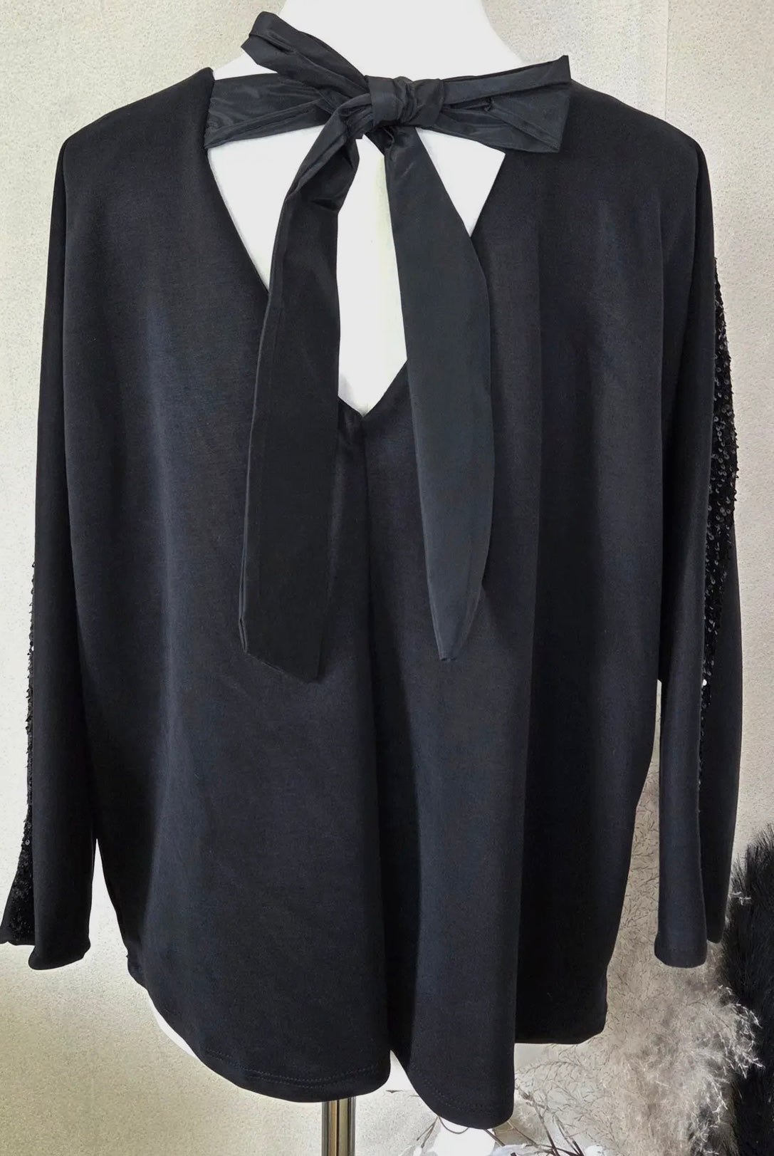 Soft V-Neck Top With Sequin Detail On The Arms & Bow At The Back In Black
